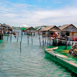 How do socio-economic considerations influence small-scale fishery management?